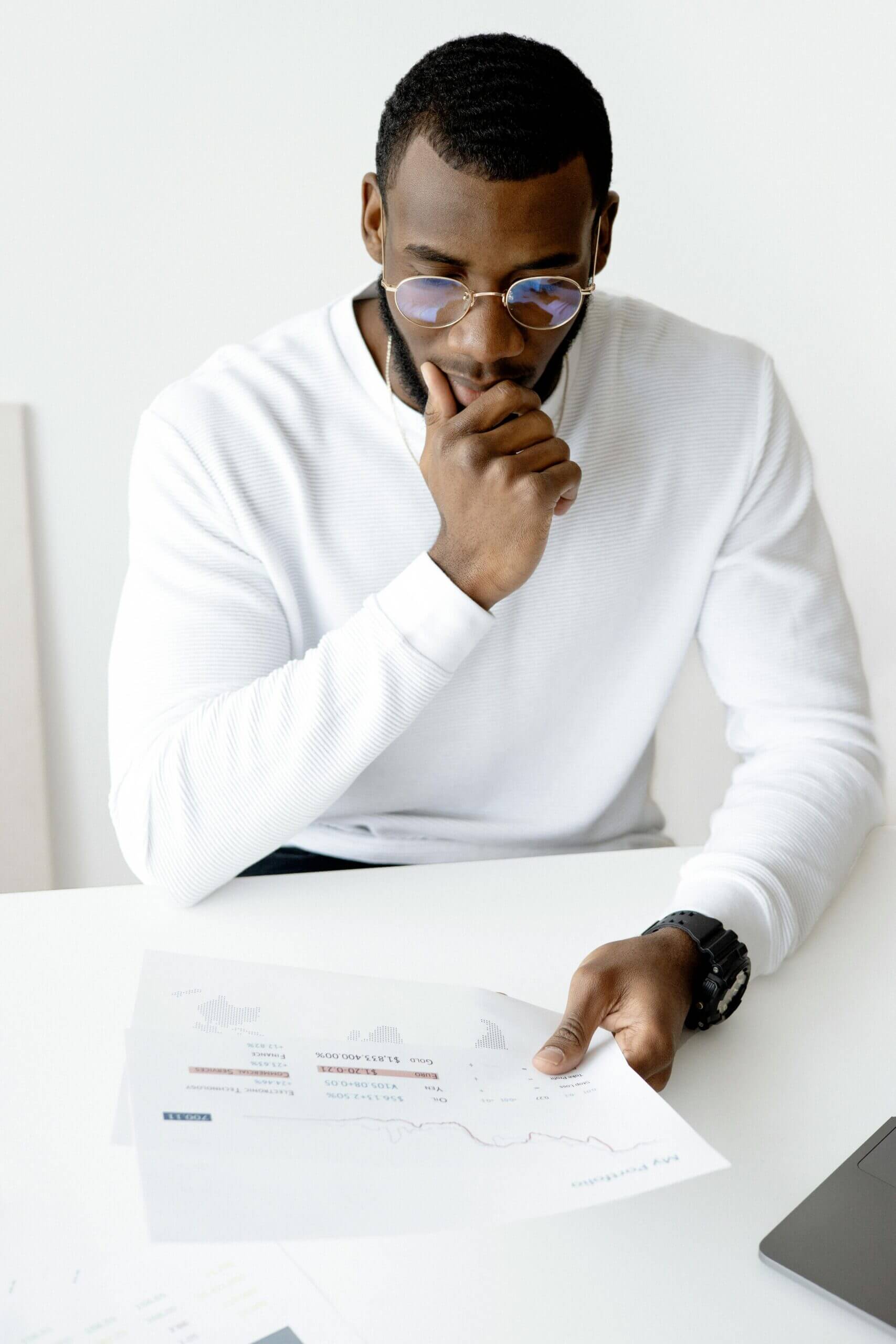 Business owner reviewing documents to apply for a start-up loan