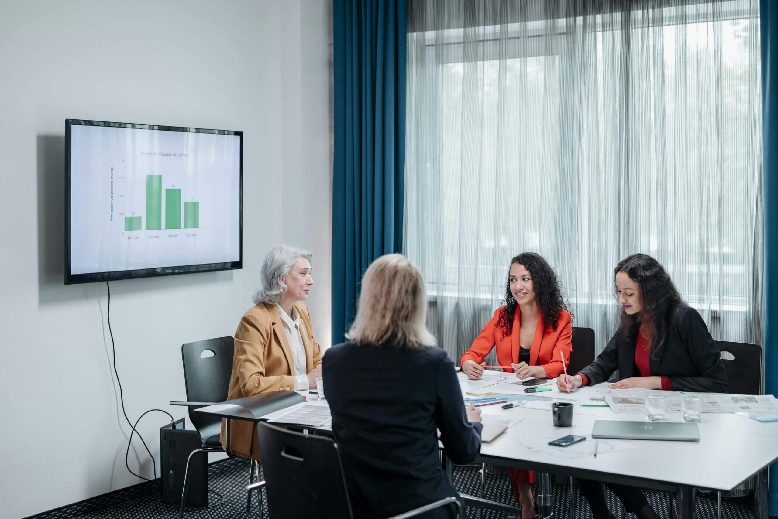 A well-dressed entrepreneur presenting a business plan to potential investors.