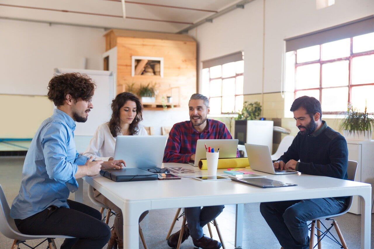 Venture capital careers: finance professionals collaborating on startup investment strategies in a high-tech office setting