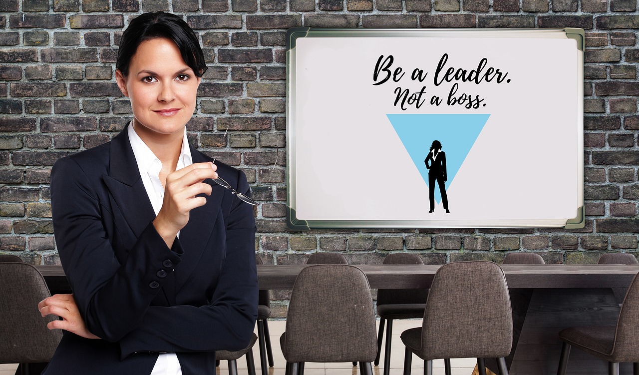 Top Leadership Traits for Business Growth - A business leader guiding a team toward success with effective leadership strategies.