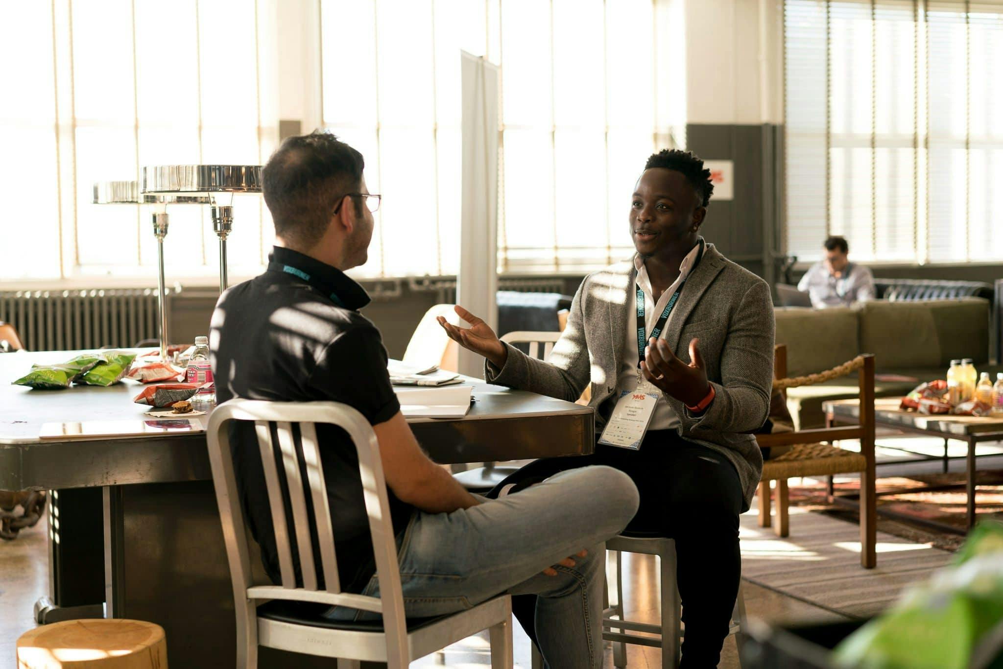 A mentor guiding a leader through decision-making, symbolizing the role of mentorship in developing leadership skills and fostering growth in leadership