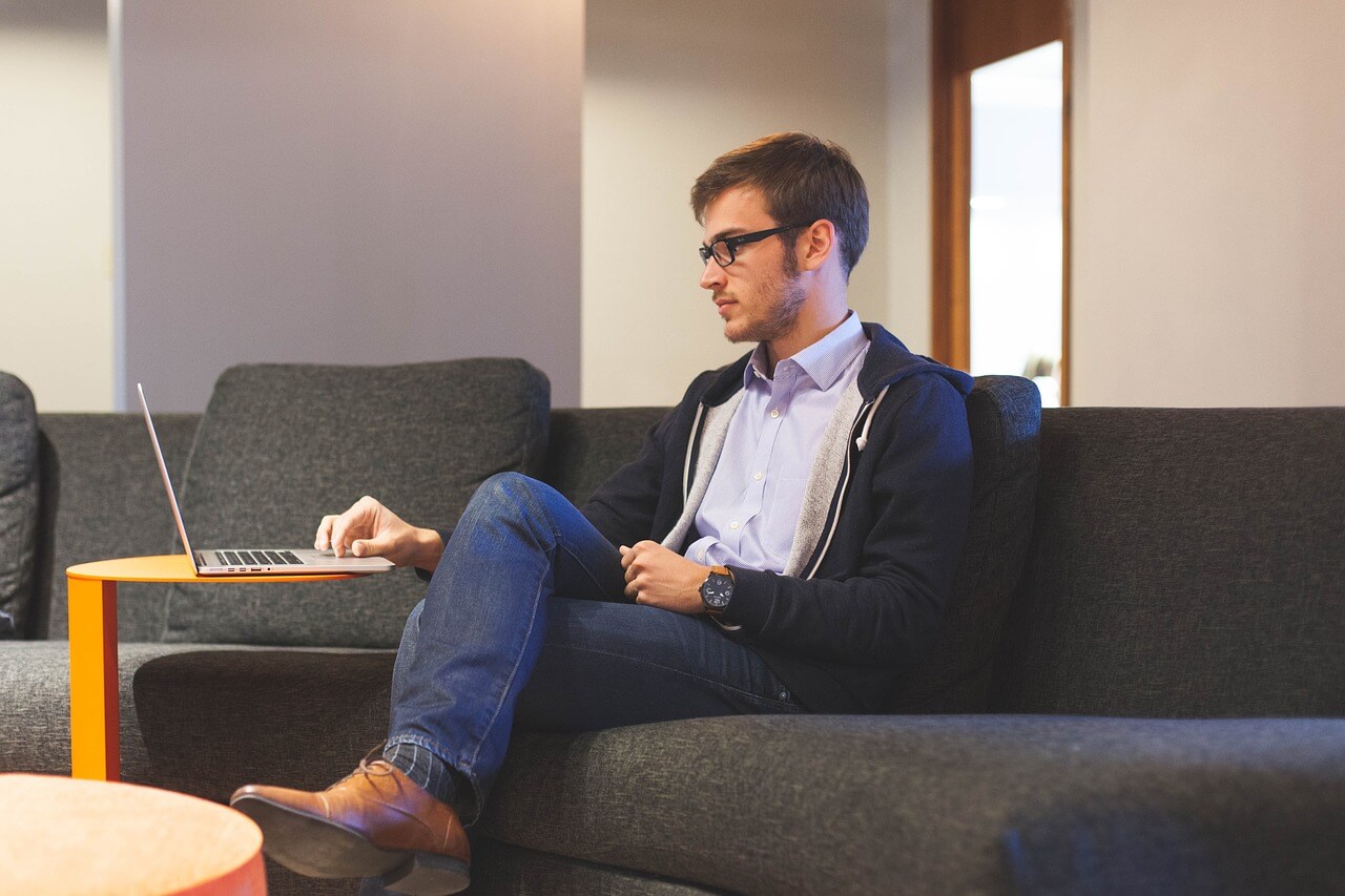 Freelancer in the gig economy working remotely on a laptop to embrace flexible work culture