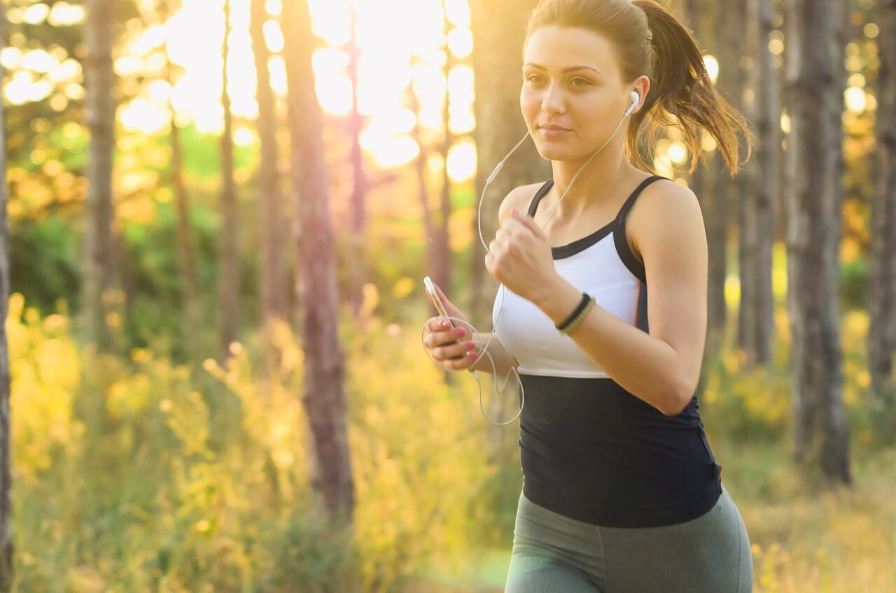 A healthy entrepreneur jogging in the park, illustrating the connection between physical health and business success