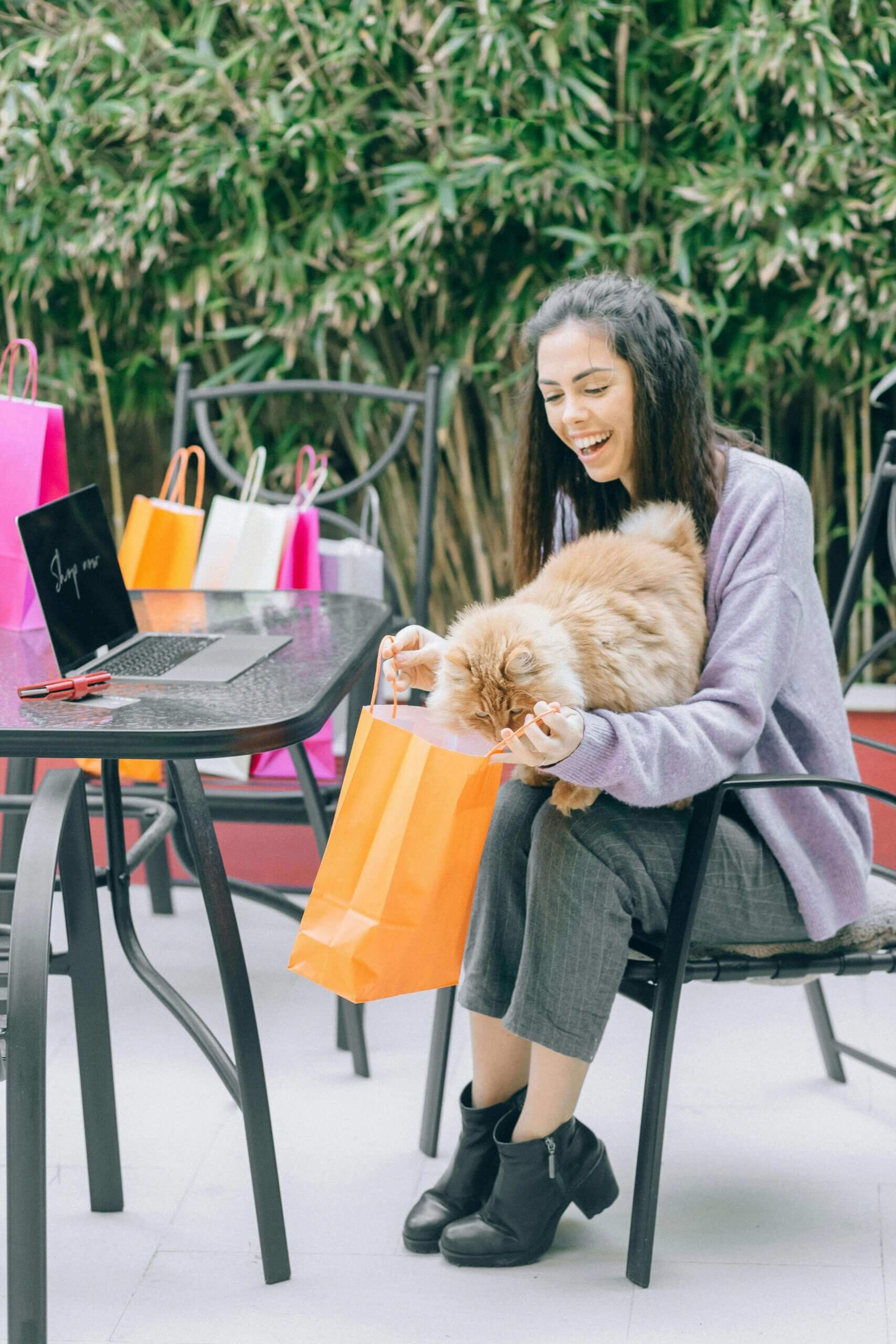 Online shopping on a laptop with a shopping cart icon, illustrating the rise of e-commerce in modern retail