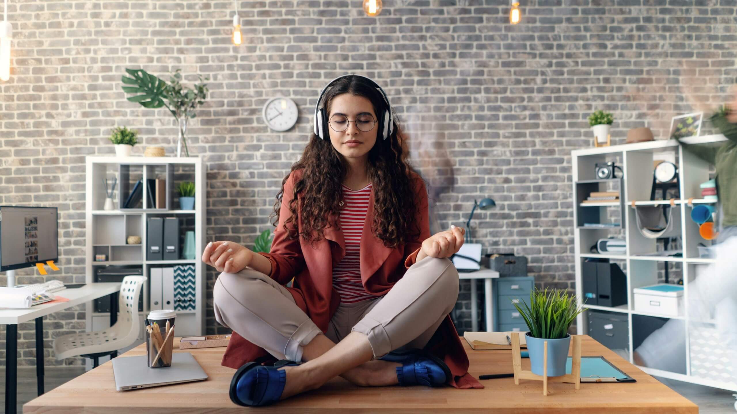 Entrepreneur practicing mindfulness meditation for stress management.